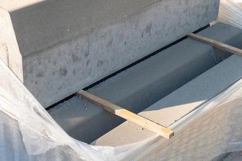 Packing concrete blocks for paving. Construction work. Stock Photos
