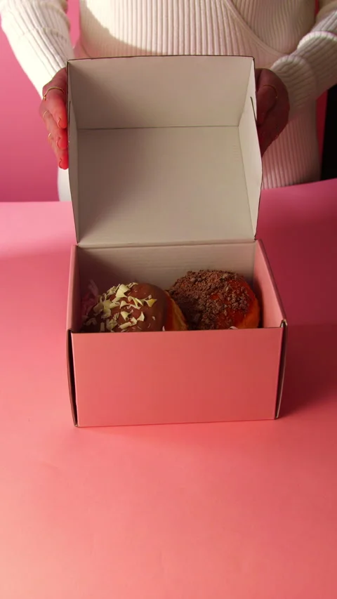 Packing Donuts for Online Delivery Stock Footage 328553904