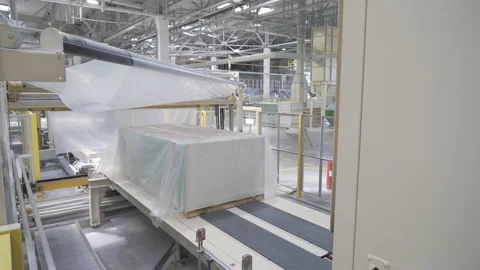 Packing drywall sheets on a conveyor. Plasterboard plant. Factory or workshop Stock-Footage 142296533