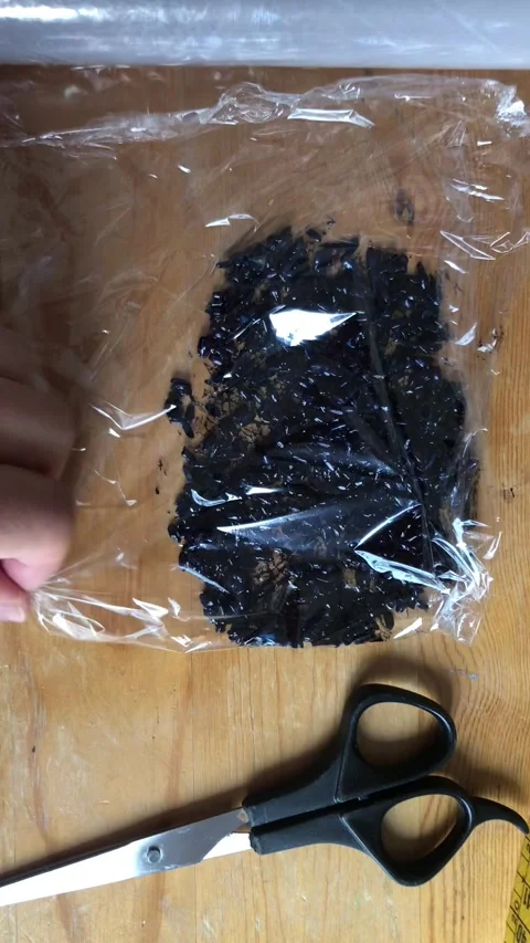Packing Dyed Dark Blue Rice Texture In Plastic Wrap CloseUp Stock Footage 333062551