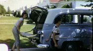 Packing Family Car Vacation Trip Suburban Usa 1950S Vintage Film Home Movie  Stock Footage