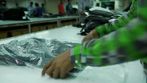 Packing final black leather jacket in factory Video stock 202462093