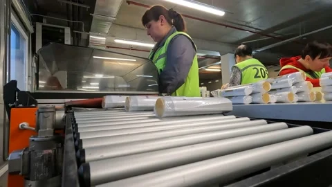 Packing goods in boxes. Preparing goods for shipment. Logistics center. Women 스톡 동영상 220557560