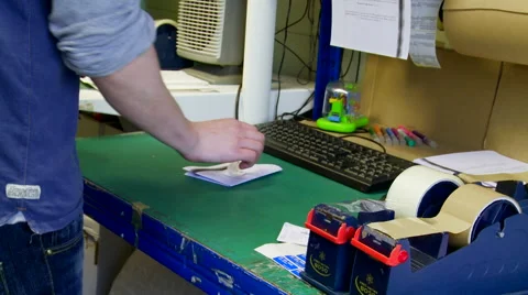 Packing an Item into a Small Postage Envelope Stock Footage 62680519