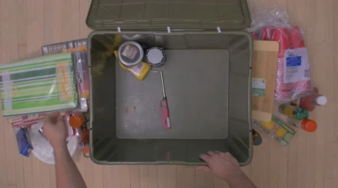 Packing Items Into Bin Camping Trip Overhead Stock-Footage 65771610