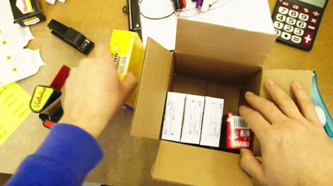 Packing items in a package Stock Footage 49696971