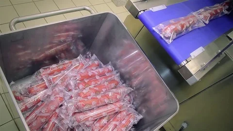 Packing line of finished products. Packing of sausages Stock Footage 74289675