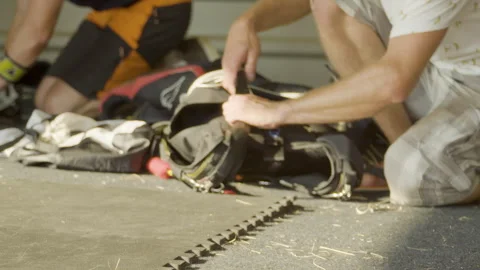 Packing a parachute into a backpack. Stock Footage 246840431