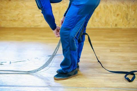 Packing a parachute into a backpack. Stock Photos