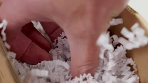 Packing parcel box with white shredded plastic filler 動画素材 241800853