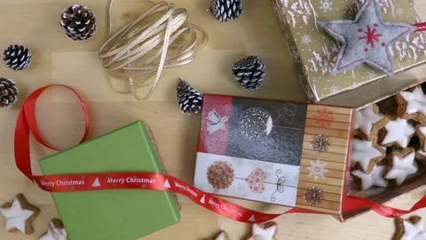 Packing the present to the box hand from about top view Stock Footage 70073526