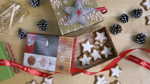 Packing the present in the box on the table with christmas decoration top view Stock Footage 70073680