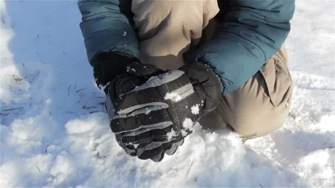 Packing A Snowball in  hands Stock Footage 93739368