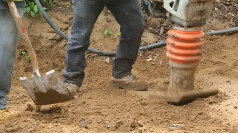 Packing soil at construction site Stock Footage 143227248