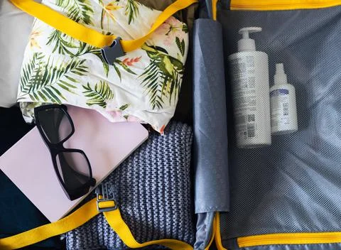 Packing stuff in a suitcase Stock Photos