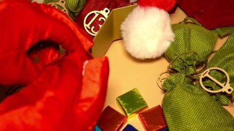 Packing sweets into small bags to make an Advent calendar. Stock Footage 321431168