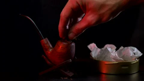 Packing a tobacco pipe Stock Footage 143990205
