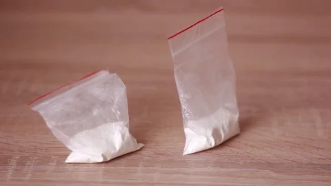 Packs with drugs throwed on table Stock Footage 83950037