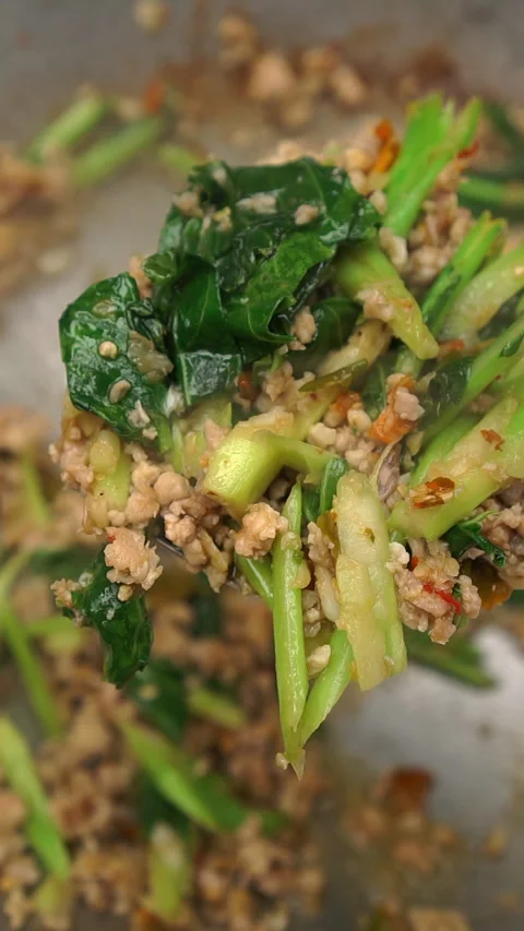 Pad Kana Kai Sab, Thai stir-fried Chinese broccoli with minced chicken. Stock Footage 337536330