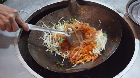Pad Thai is being cooked in a wok, Bangkok, Thailand Stock Footage 248807308