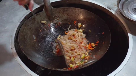 Pad Thai is being cooked in a wok, Bangkok, Thailand Stock Footage 250497931