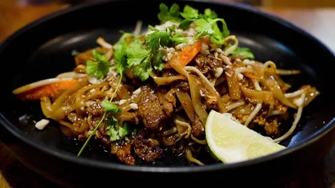 Pad Thai, one of most popular dish dishes in Thai cuisine Stock Footage 310912490