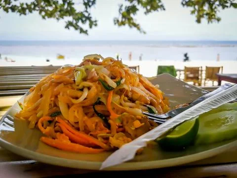 Pad Thai on table at the beach Stock Photos