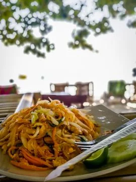 Pad Thai on table at the beach Stock Photos