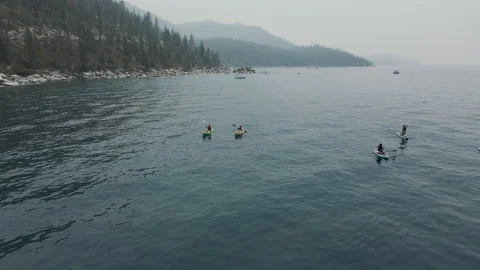 Paddle board adventures on the lake. Summer water sport activities  Stock Footage 164640085