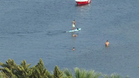 Paddle Board and Holidaymakers Bodrum Turkey Stock Footage 105187431