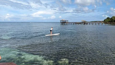 Paddle Board off the Dock 2 Stock Photos
