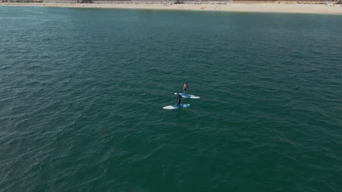 Paddle board floating on the Pacific Ocean Mexico Stock Footage 157825544