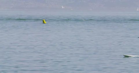 Paddle boarder in the bay Stock Footage 37057310