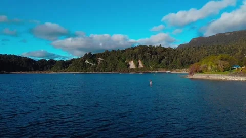 Paddle boarder on lake Stock Footage 251504962