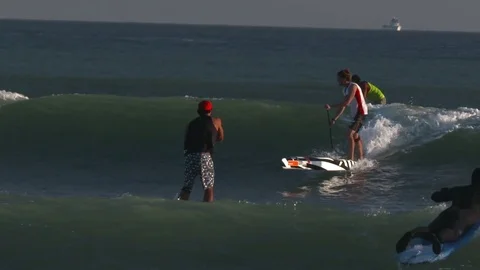 Paddle Boarders on ocean in California Stock Footage 77488853