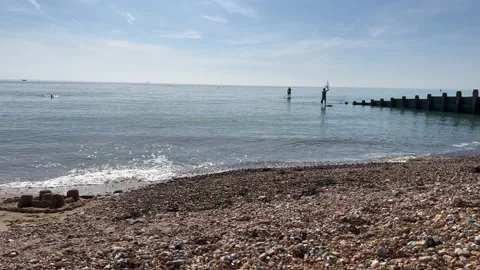 Paddle boarders in the sea Stock Footage 239655089