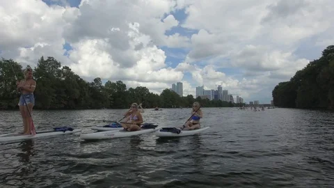 Paddle Boarding Down the Colorado River Austin Texas USA Stock Footage 128934871
