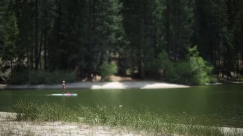 Paddle boarding on the lake Stock Footage 50797031