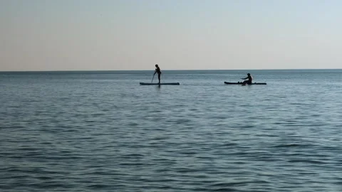 Paddle boarding on the sea. Stock Footage 303043760
