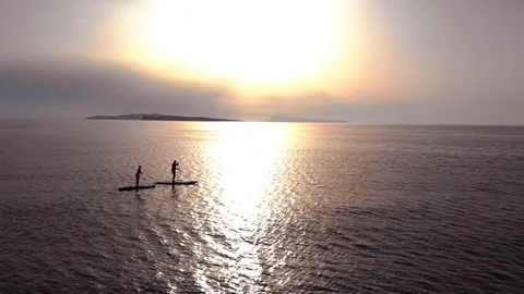 Paddle boarding at sunset Stock Footage 91495725