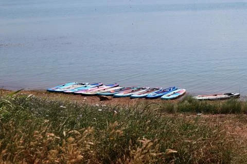 Paddle boards on the beach Stock Photos
