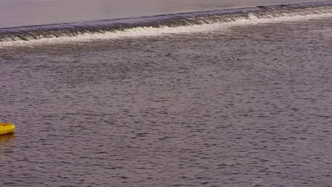 Paddle Boat in front of weir in Prague Stock Footage 82711648
