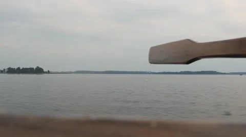 Paddle boat rowing on a lake Stock Footage 68944609