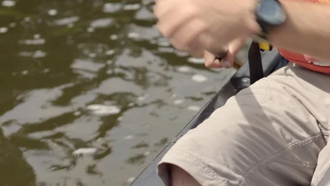 Paddle stroke in a canoe on a river Stock Footage 97705104