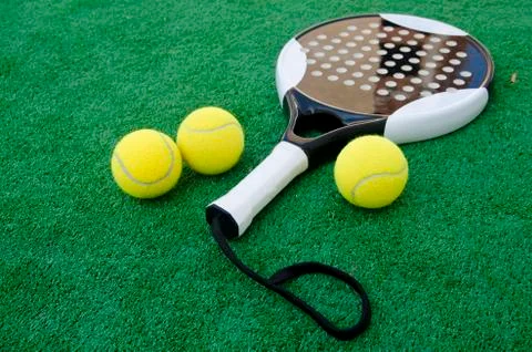 Paddle tennis objects on turf Stock Photos