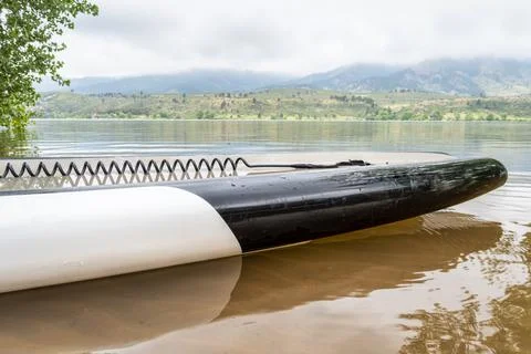 Paddleboard with safety leash Stock Photos