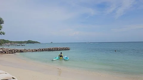 Paddleboarder on the Beach in Isla del Rosario, Cartagena Stock Footage 286381053
