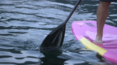 Paddleboarder Using Paddle to Cut Through Water Stock Footage 102405325