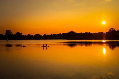 Paddleboards at Sunset Stock Photos