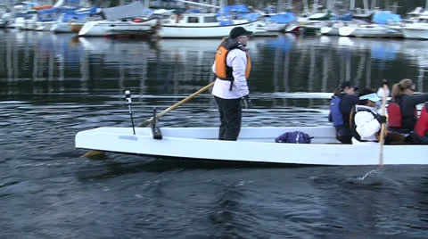 Paddlers In Long Canoe Setting Off From Dock Stock Footage 22640867